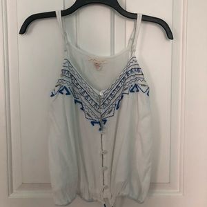 Embroidered blue and white top